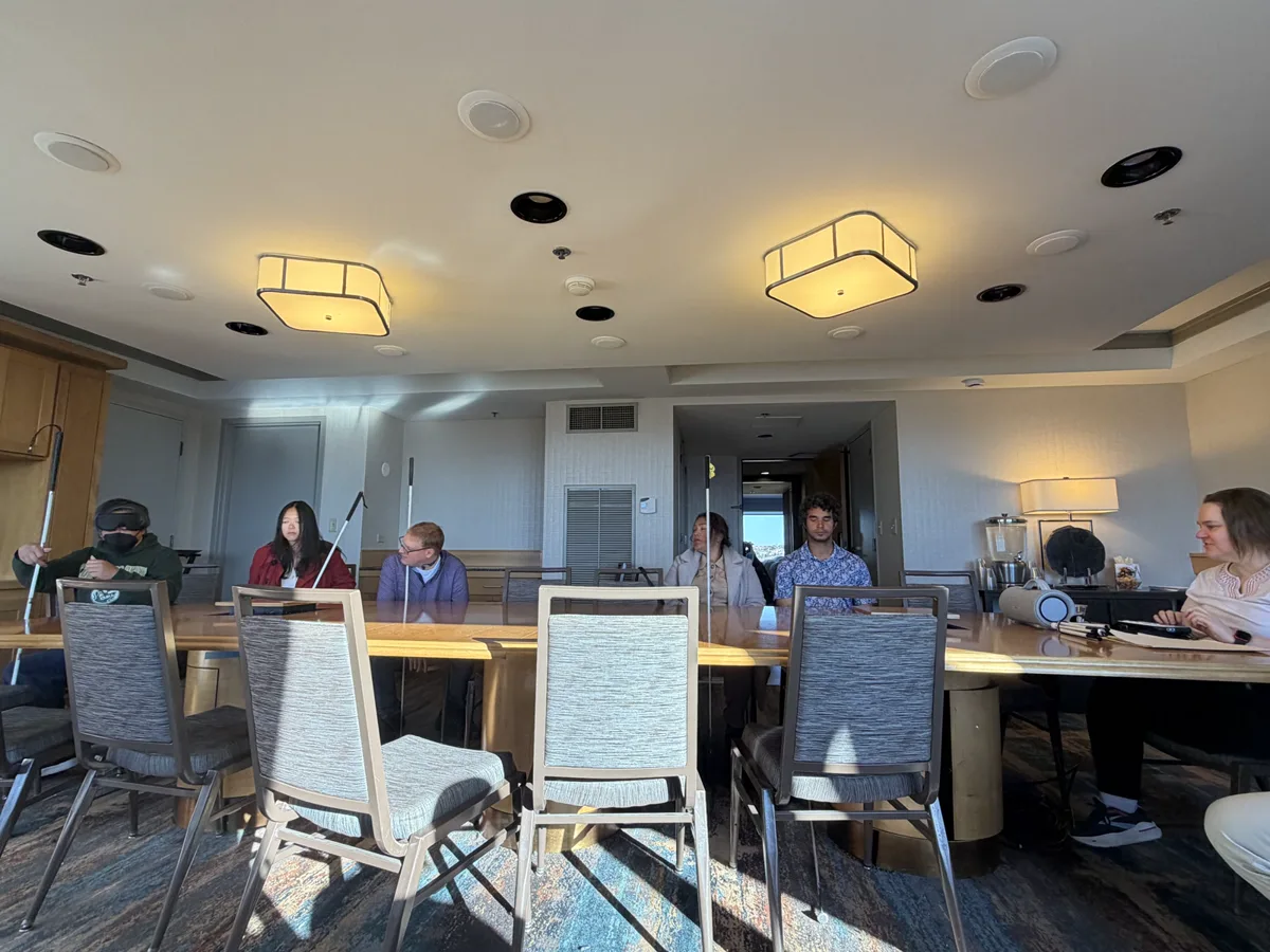Sautana Howery presents a voice-acting career exploration to participants seated around a conference room.